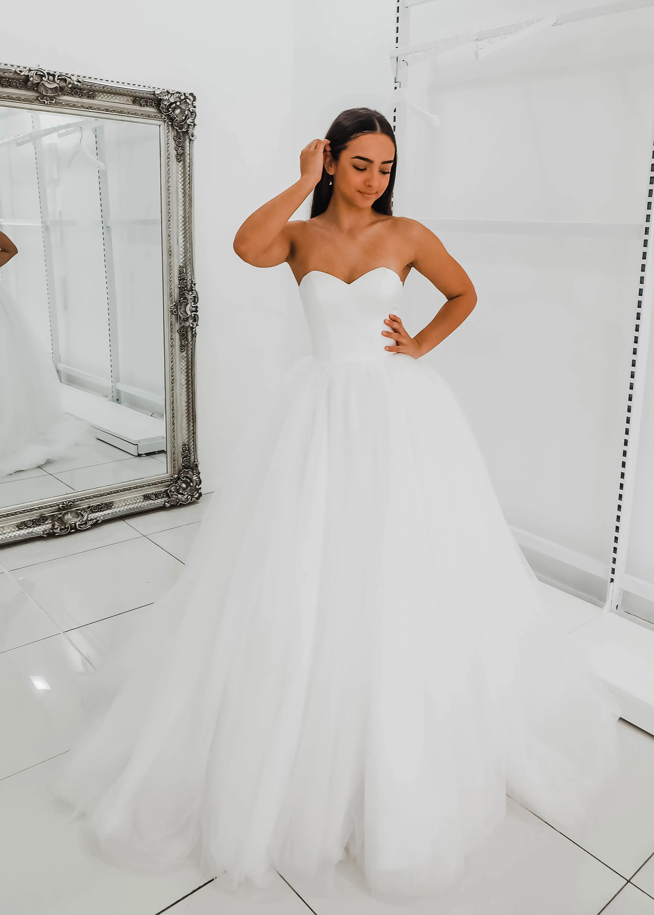 White sweetheart neckline and satin bodice with puffy tulle skirt wedding dress