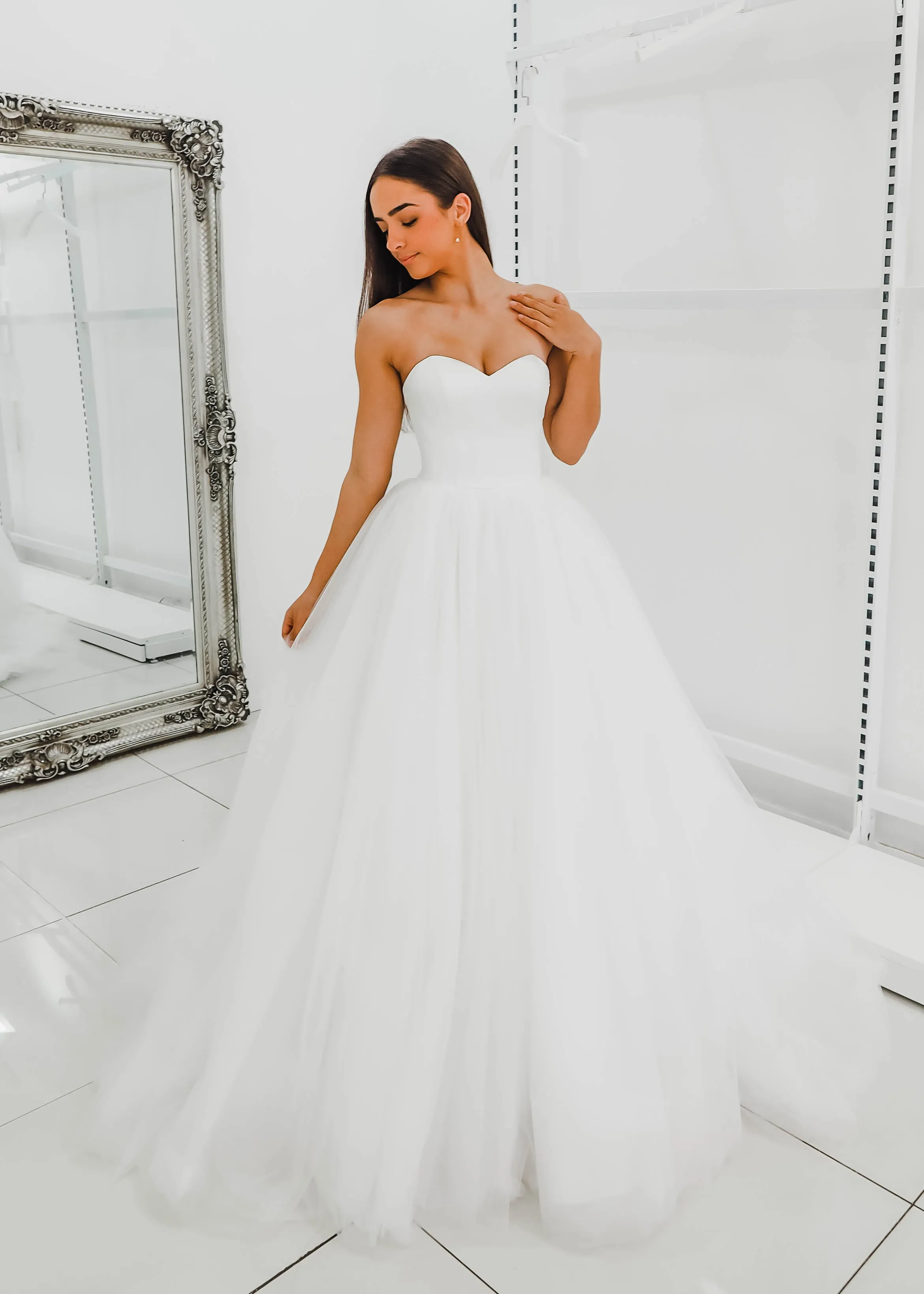 White sweetheart neckline and satin bodice with puffy tulle skirt wedding dress